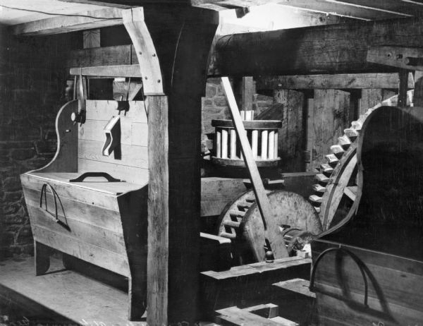 The gears and machinery of an old mill.
