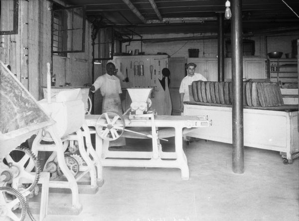 A view of two men standing in the bakery at Winthrop College.