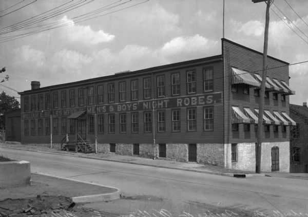 The factory of William E. Belles, with the text, "William E. Belles MFGR of Men's and Boy's Night Robes".