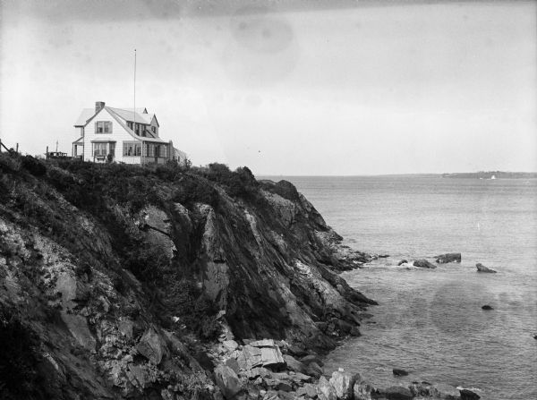 A view of the Bonnet Shores Club atop a cliff overlooking the ocean.