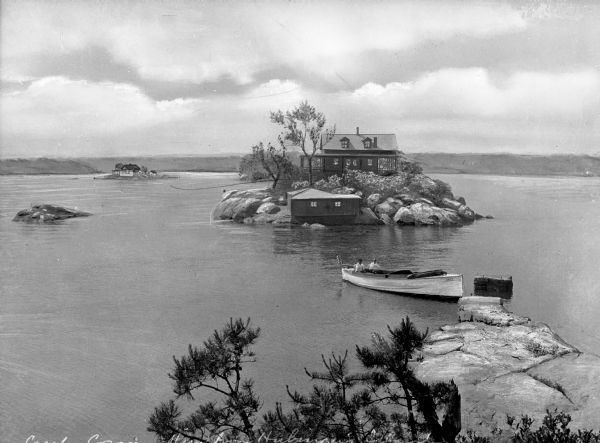 Elevated view from Hubinger's Island featuring other islands, homes, and a boat.