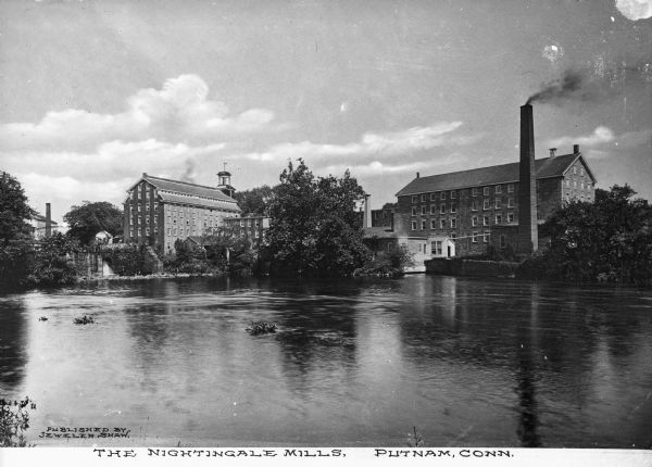 View of Nightingale textile mill and stone dam across river Quinebaug. Caption reads: "The Nightingale Mills, Putnam, Conn."