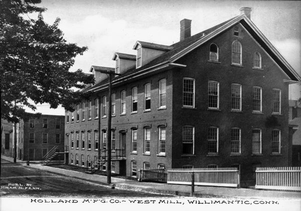 Street side view of Holland Manufacturing Company's West Mill, silk producers. Caption reads: "Holland M'F'G. Co. - West Mill, Willimantic, Conn."