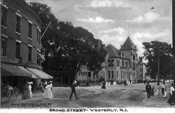 Street side view of foot traffic on Broad Street with large brick buildings. Caption reads: "Broad Street - Westerly, R.I."