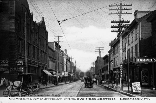 View of Cumberland Street's business section with the Sons of America Hall on the left. Caption reads: "Cumberland Street, In The Business Section, Lebanon, PA."