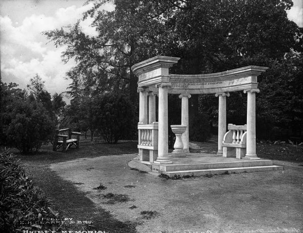 Classical stone memorial with six columns to the memory of Jennie Higbee, founder and principal of a local school for girls. Located in Overton Park which was designed in 1901 by George E. Kessler, consulting landscape architect to the Memphis Park Commission from 1901 to 1914. Caption reads: "Higbee Memorial."
