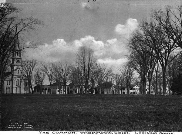 View across the town's commons bordered with trees and stately town buildings. Caption reads, "The Common, Thompson, Conn. Looking South."