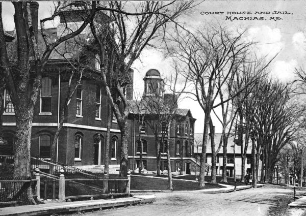 A street view of the Court House and jail. Caption reads: "Court House and Jail, Machias, Me."