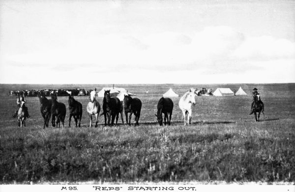 View of horses and a man on horseback in the foreground, with four tents a herd gathered together in the background on a range. Caption reads: "'Reps' Starting Out."