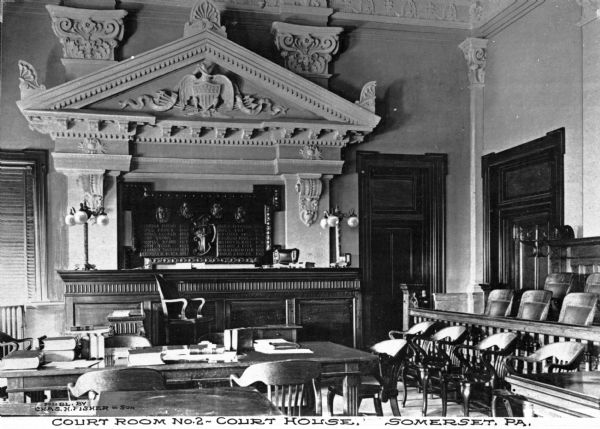 View of the interior of the Court Room, taken near the tables in front of the judge's podium, with the jury box on the right. Caption reads: "Court Room No. 2 — Court House. Somerset, PA."