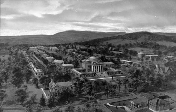 An aerial view of the University of Virginia. The main building in the foreground references the Roman Pantheon and features a Classical-style porch, columns, pediment, and dome. Other structures line the grassy mall behind the main structure and trees surround the campus.