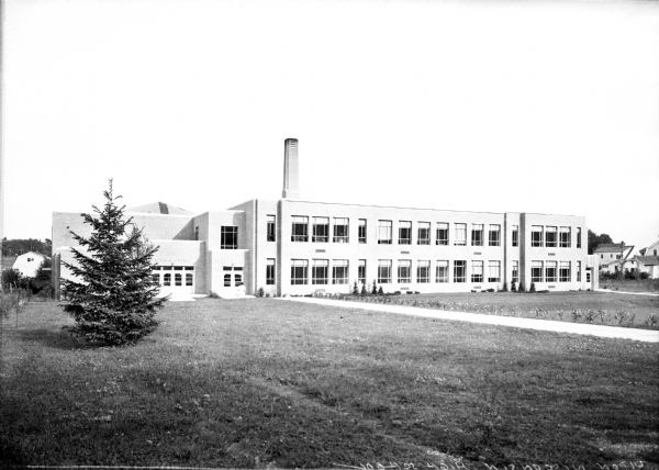 View across lawn toward the window-lined facade of Ripon High School.