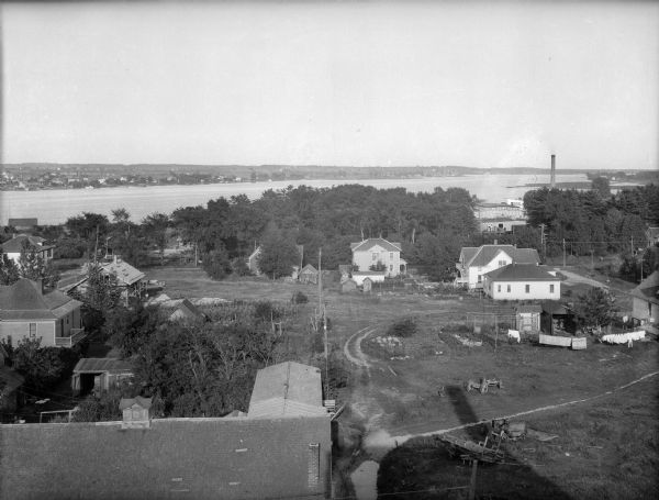 Elevated view of Sturgeon Bay with houses in the foreground.
