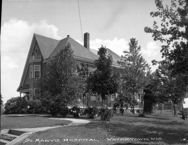 View across lawn toward St. Mary's Hospital. Caption reads: "St. Mary's Hospital, Watertown, Wis."