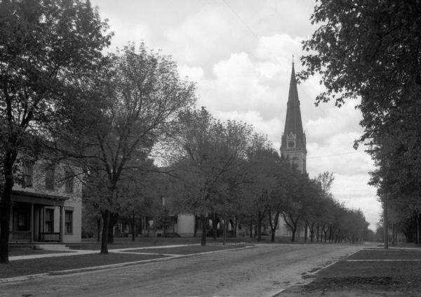A view looking north on Church Street. The steeple partially hidden by the trees is St. Bernard's Catholic Church.