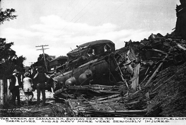 View of the train wreck which occurred September 15th. The locomotive lies on its side with a damaged passenger car. Caption reads: "The wreck at Canaan, N.H., Sunday, Sept. 15, 1907, twenty-five people lost their lives, and as many more were seriously injured."