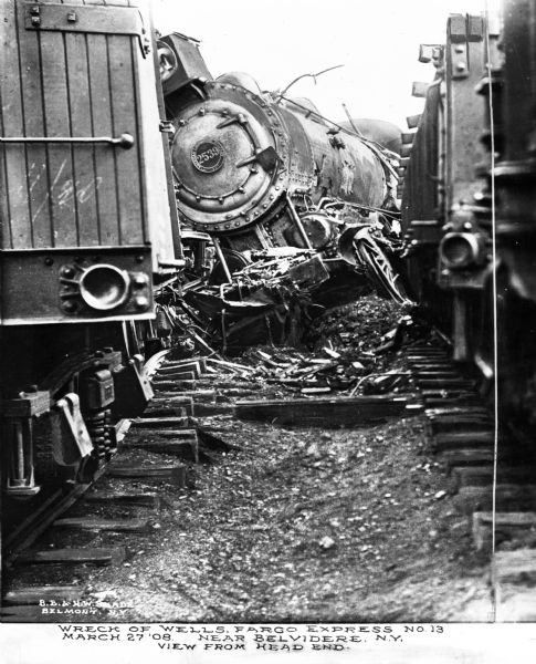 View of the wreck of the Wells Fargo Express number 13, March 27th. Number on the front of the train is "2539." Caption reads: "Wreck of the Wells Fargo Express No. 13 March 27 '08 Near Belvidere, N.Y. View from head end."