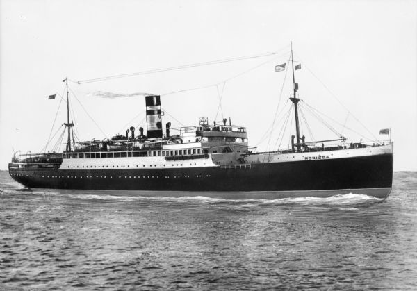 View of the S.S. "Nerissa" ocean liner in the water near New York City. the ship features a large smokestack, two masts and several flags.