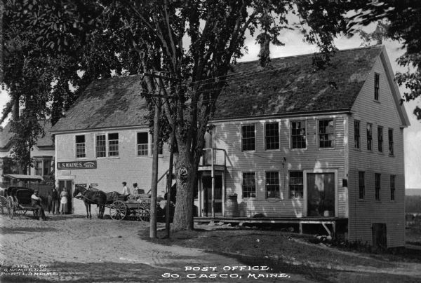 Exterior of a post office with a horse-drawn carriage parked to the left. Caption reads: "Post Office, So. Casco, Maine."