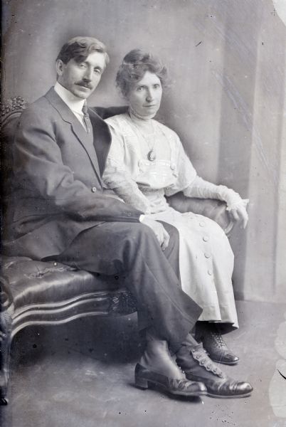 A seated studio portrait of the photographer and his wife, Alice Kent Trimpey.