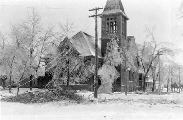 Downed wires and broken tree limbs mar the scene in front of the First Congregational Church at 131 6th Avenue.