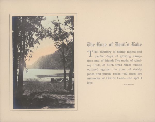 A hand-tinted photograph of a tree-framed scene along the shore of Devil's Lake is mounted on a piece of beige paper. A large bluff dominates the background. A rowboat rests on the near shore. A short essay by Alice Kent Trimpey, the photographer's wife, is printed alongside the photograph.