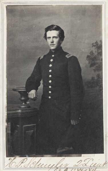 Three-quarter-length carte-de-visite portrait of 2nd Lieutenant Herman P. Schuyler, Company A, 1st Wisconsin Infantry, in front of a painted backdrop.