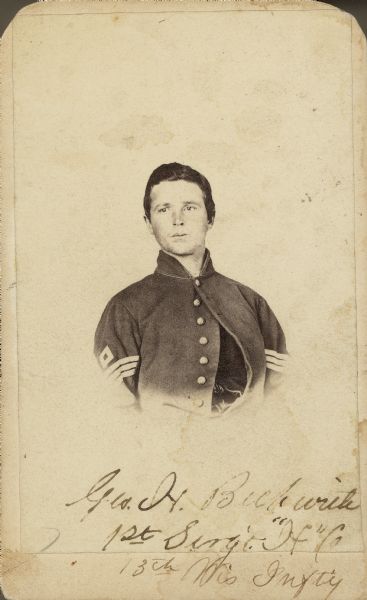 Vignetted carte-de-visite of 1st Sergeant (promoted to 1st Lieutenant) George H. Beckwith, Company H, 13th Wisconsin Infantry. In the photograph he has the rank of 1st Sergeant.