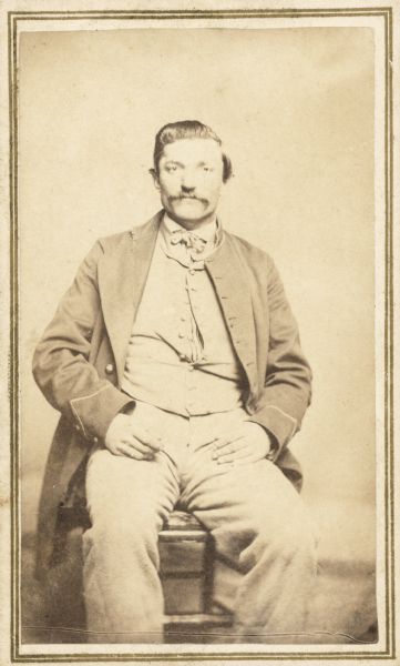 Seated carte-de-visite portrait of John F. Harker, Company K, 13th Wisconsin Infantry.