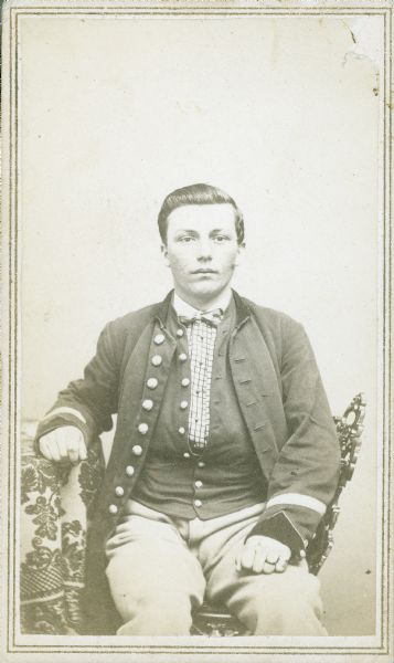 Seated carte-de-visite portrait of Corporal Elizah Hudson, Company K, 13th Wisconsin Infantry.