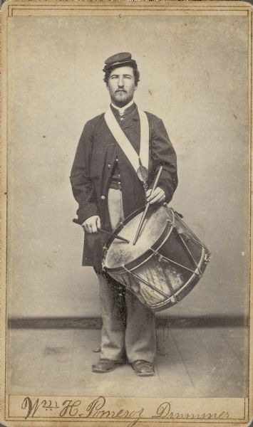 Full-length carte-de-visite portrait of Drummer William H. Pomeroy, Company G, 13th Wisconsin Infantry, with drums.