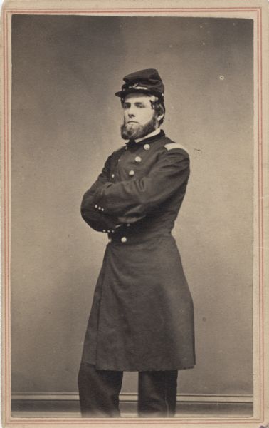 Three-quarter length carte-de-visite portrait of Colonel Cassius Fairchild, F & S, 16th Wisconsin Infantry, wearing his full uniform.
