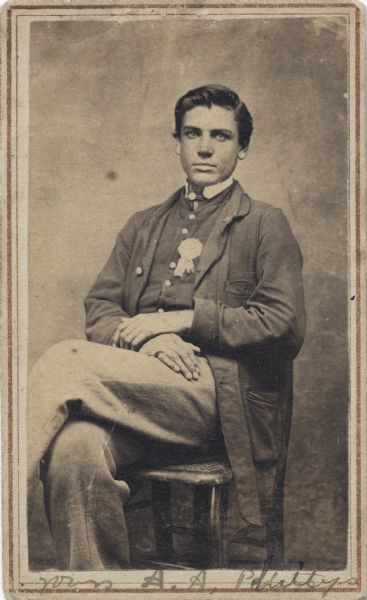 Seated carte-de-visite portrait of Private Amos A. Phillips, Company F, 16th Wisconsin Infantry.
