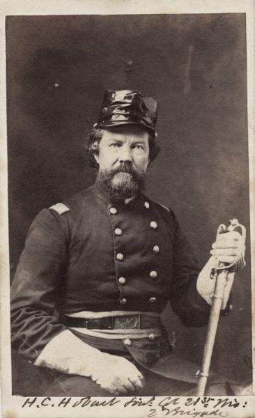 Seated carte-de-visite portrait of Colonel Harrison Carroll Hobart, F & S, 21st Wisconsin Infantry, wearing gauntlet gloves and holding his sword.