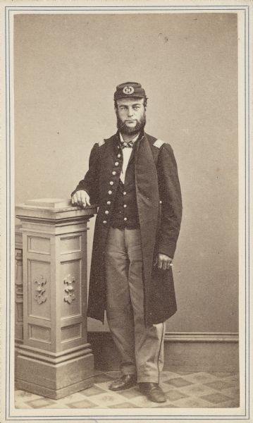 Full-length carte-de-visite portrait of Orrin W. Beach, Companies B and A, 34th New York Infantry. When the regiment was originally mustered in (June 1861 at Albany, New York), Orrin W. Beach held the rank of Sergeant. When they were mustered out (June 1863) he held the rank of 2nd Lieutenant.