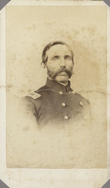 Vignetted carte-de-visite portrait of Major Micaiah F. Fairfield, F & S, 1st Alabama Cavalry (Union). Micaiah was the son of Samuel Fairfield, Jr. He was born July 5, 1823, in Pittsfield, Vermont, and attended Oberlin College in Ohio from 1845-46. He enlisted as a 2nd Lieutenant on July, 8 1862 in Company Ford's Independent Cavalry Regiment of Illinois. He transferred to Company L, 15th Illinois Cavalry, on December 25, 1862, and was promoted to Major on April 22, 1863. He also received his commission in Company S, 1st Alabama Cavalry, on April 22, 1863. 