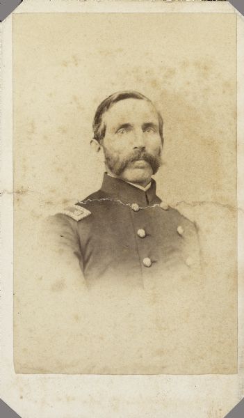 Vignetted carte-de-visite portrait of Major Micaiah F. Fairfield, F & S, 1st Alabama Cavalry (Union). Micaiah was the son of Samuel Fairfield, Jr. He was born July 5, 1823, in Pittsfield, Vermont, and attended Oberlin College in Ohio from 1845-46. He enlisted as a 2nd Lieutenant on July, 8 1862 in Company Ford's Independent Cavalry Regiment of Illinois. He transferred to Company L, 15th Illinois Cavalry, on December 25, 1862, and was promoted to Major on April 22, 1863. He also received his commission in Company S, 1st Alabama Cavalry, on April 22, 1863.
