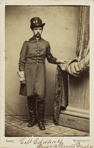 Full-length carte-de-visite portrait of Elisha Esterbrooks, a Brigade Quartermaster, Company B, 35th Wisconsin Infantry.