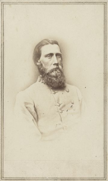 Waist-up vignetted carte-de-visite portrait of Lieutenant General John Bell Hood. He entered the Confederate army as a colonel and was quickly promoted to Brigadier General of the Texas brigade. For his actions at the Battle of Gaines's Mills he was promoted to Brigadier General. He served in the Battles of Second Manassas (Second Bull Run), Antietam, and Gettysburg. In September 1863 he was ordered to Tennessee to reinforce Confederate forces at the Battle of Chickamauga. In July 1864 Confederate President Jefferson Davis placed Hood in command of the Army of Tennessee. Hood was repeatedly defeated at the Battles of Atlanta, Franklin, and Nashville. Following these defeats Hood was relieved from command.
