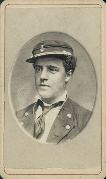 Quarter-length carte-de-visite portrait of Charles S. Williams from Prairie du Chien, wearing Navy uniform and hat.