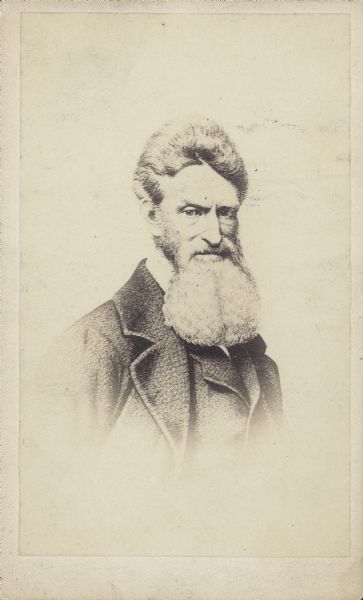 Engraved vignetted carte-de-visite of John Brown, who led a raid on the U.S. Arsenal on October 16, 1859, at Harper's Ferry in the hopes of capturing weapons there and going on to destroy the slave system in the South. Brown and some of his raiders were captured by Federal forces and convicted of treason. His actions served to inflame the dispute between the abolitionist and pro-slavery factions and harden the lines that separated the North and the South.