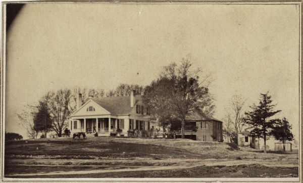 View from distance of residence used as headquarters when S.G. Swain was in charge of fortifications at Fort McPherson.
