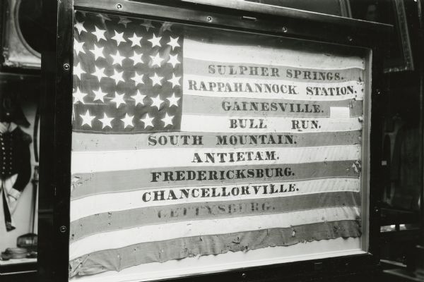 Miner's Guard Flag of Company I, Second Wisconsin Volunteer Infantry of the Iron Brigade carried during the Civil War. The flag was made by Mrs. George Cobb of Mineral Point, Wisconsin, and is owned by the Wisconsin Historical Society.