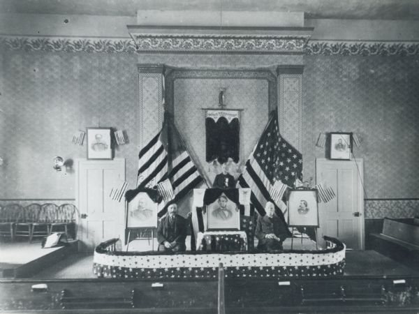 Grand Army of the Republic, Jairus Richardson, Post No. 12 in Sheboygan Falls, Wisconsin, meeting at the Methodist Church. From left to right are: Charles Herman, Charles Meyelia, and W. Burgess.