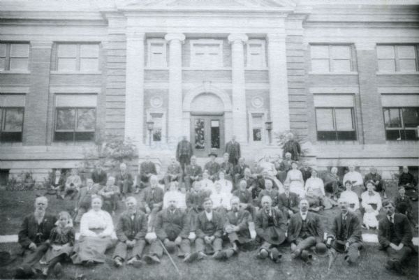 Third Wisconsin Civil War veterans' reunion, posed on the lawn in front of the Beloit Public Library.