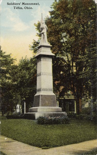 A colored postcard view of a Union memorial Caption reads: " Soldiers' Monument, Tiffin, Ohio."