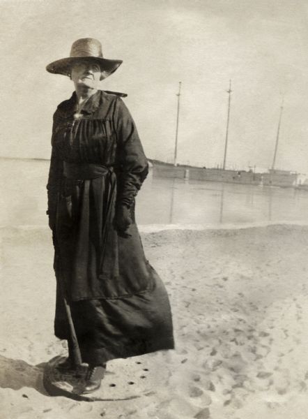Katherine (Kate) Quinney, Richard Quinney's great aunt, standing on the shore of Lake Michigan with a ship in the background.