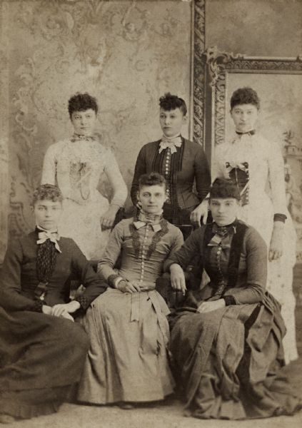 Formal studio portrait of the six Reynolds sisters: Anna, Ellen, Lucy, Hattie, Alice and Nellie. Hattie Reynolds, standing in the back left, was Richard Quinney's grandmother.