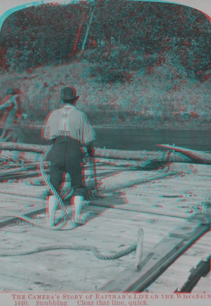 Stereograph of a raftsman holding a rope as a second man is running towards the edge of the raft.