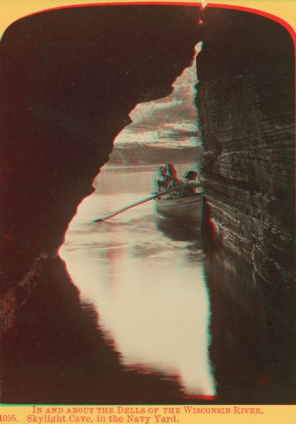 Stereograph though Skylight Cave (in the Navy Yard) of three people in a rowboat.